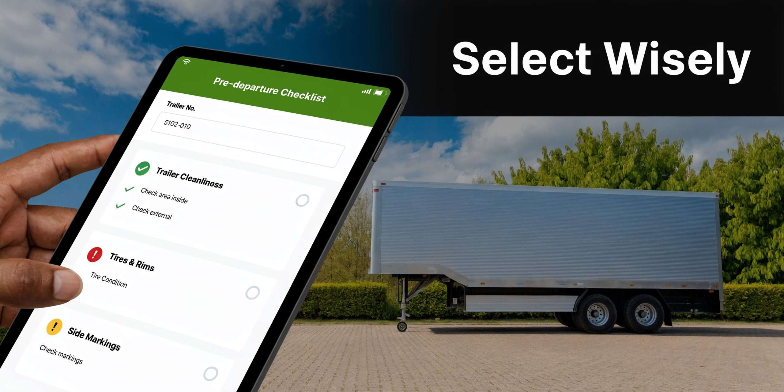 A hand holding a digital tablet showing a trailer pre-departure checklist next to a single drop deck trailer.